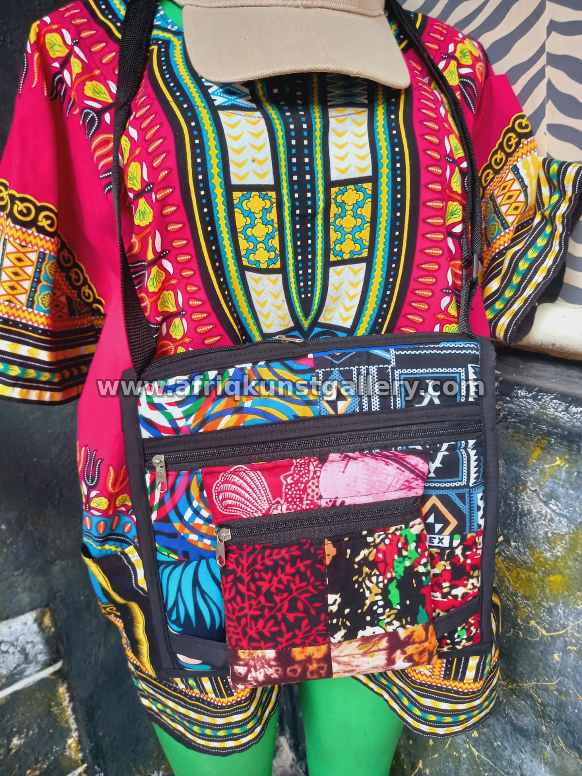 Patchwork crossbody bag styled over a colorful dashiki top.
