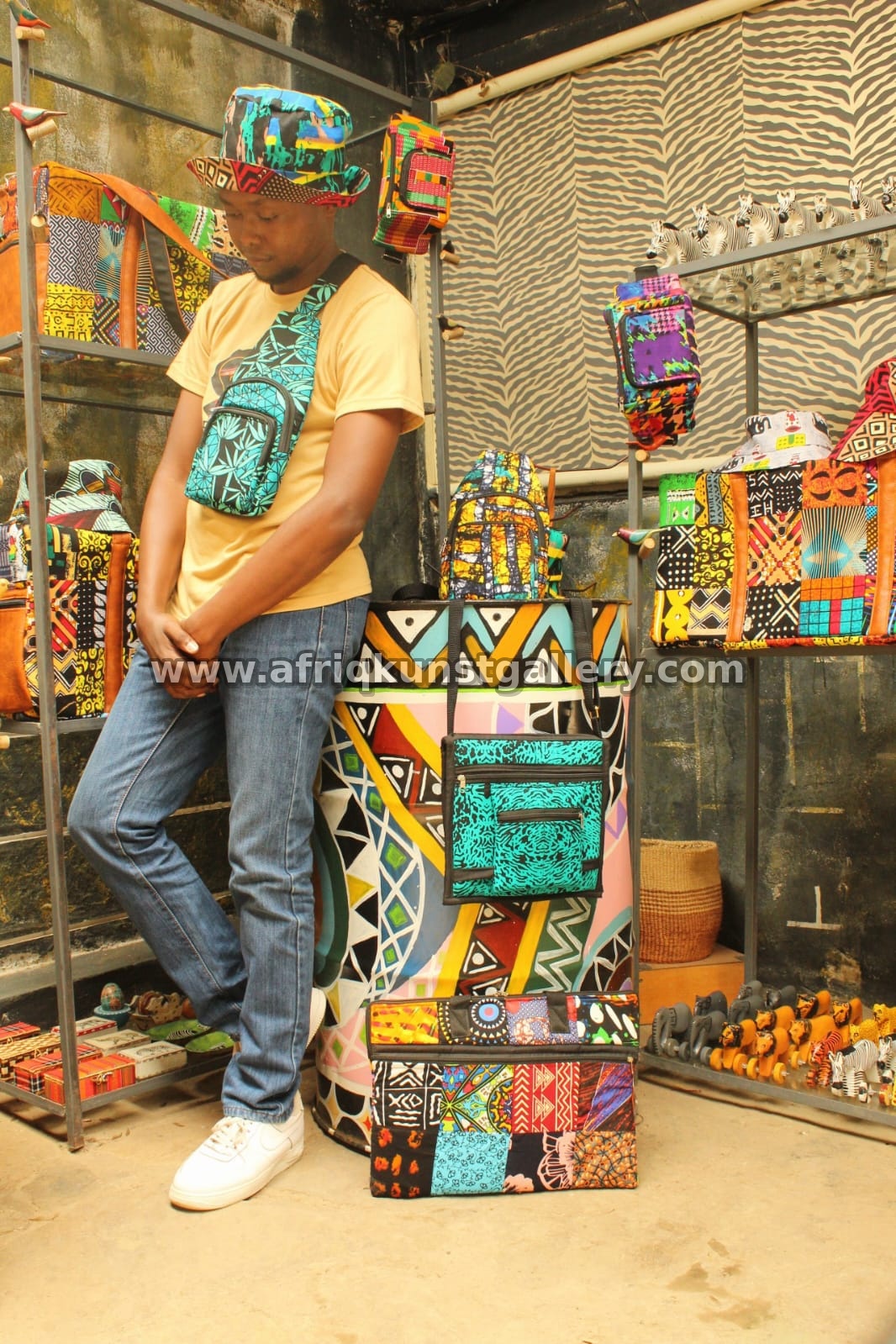 Gallery styling with hats, bags and colorful textile accessories.