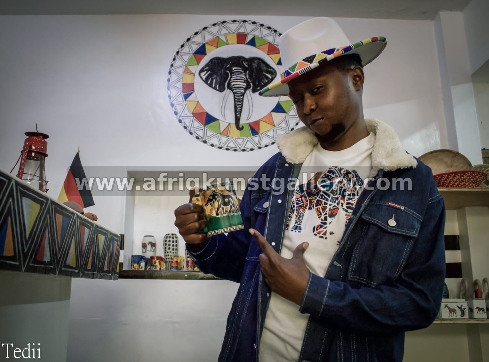 Elephant print mug and white tee living as part of a handcrafted African lifestyle display