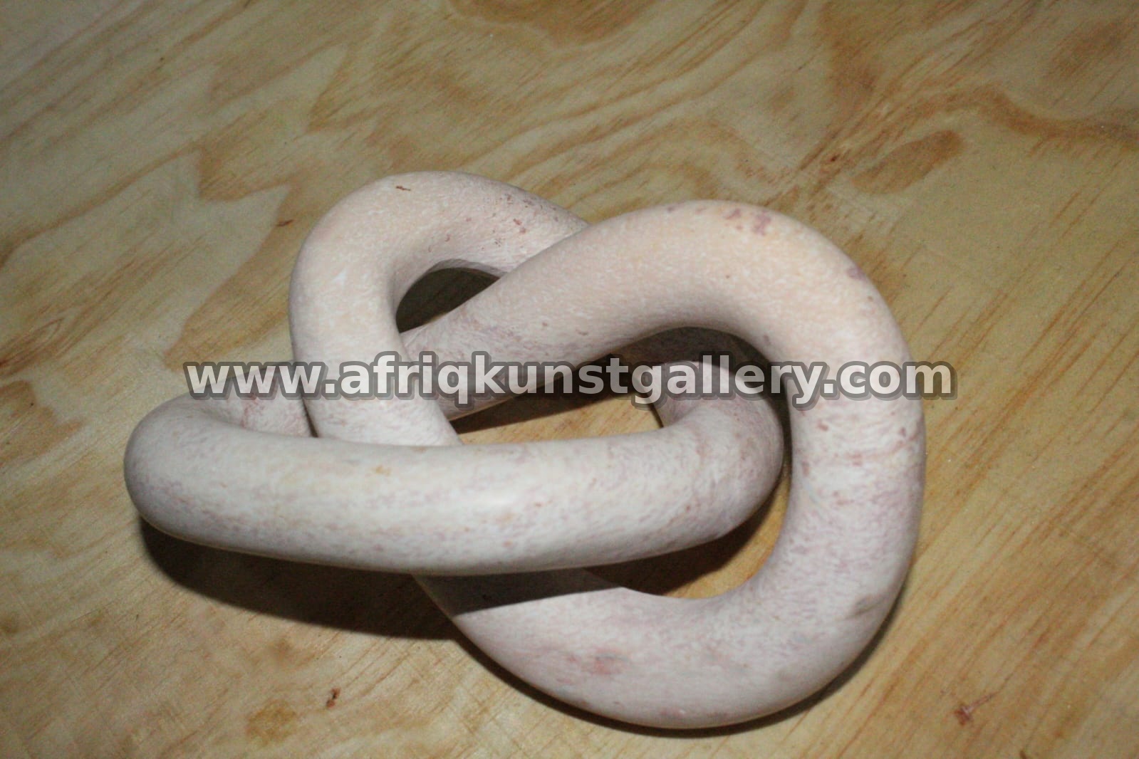 White Soapstone Interlocking Knot Sculpture.