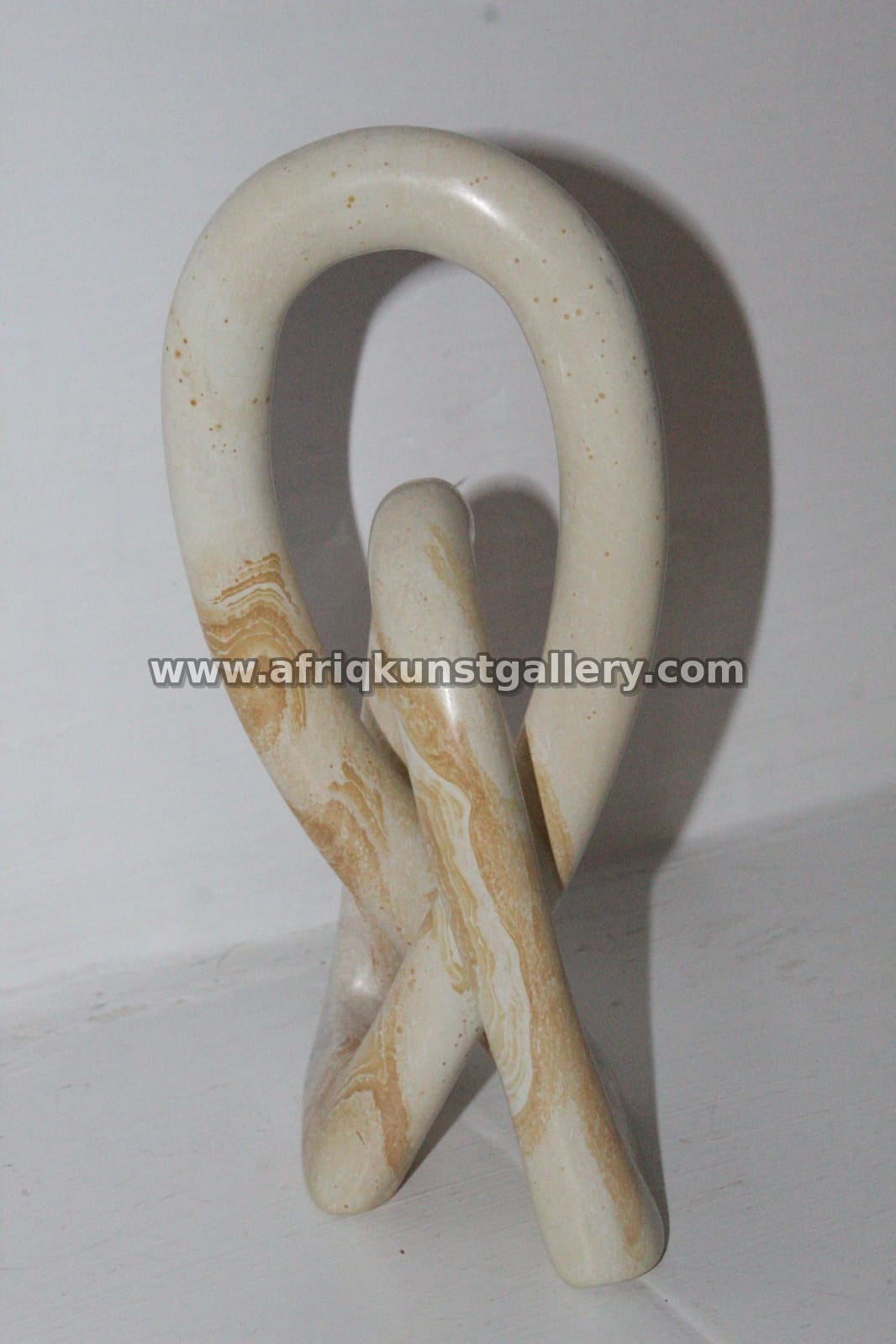 White Soapstone Loop Knot Sculpture.