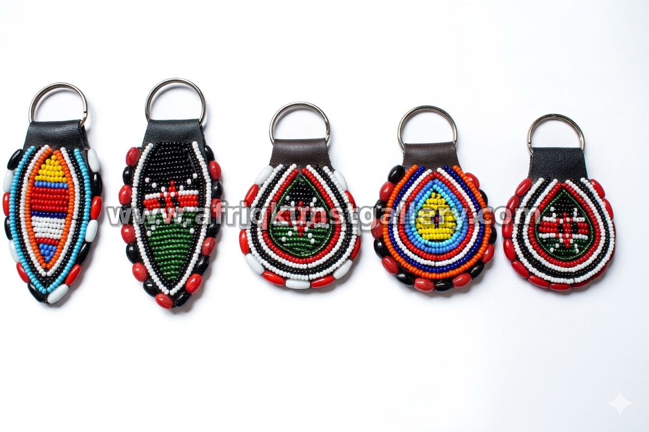 Assorted handcrafted beaded keyholders in shield and teardrop shapes.