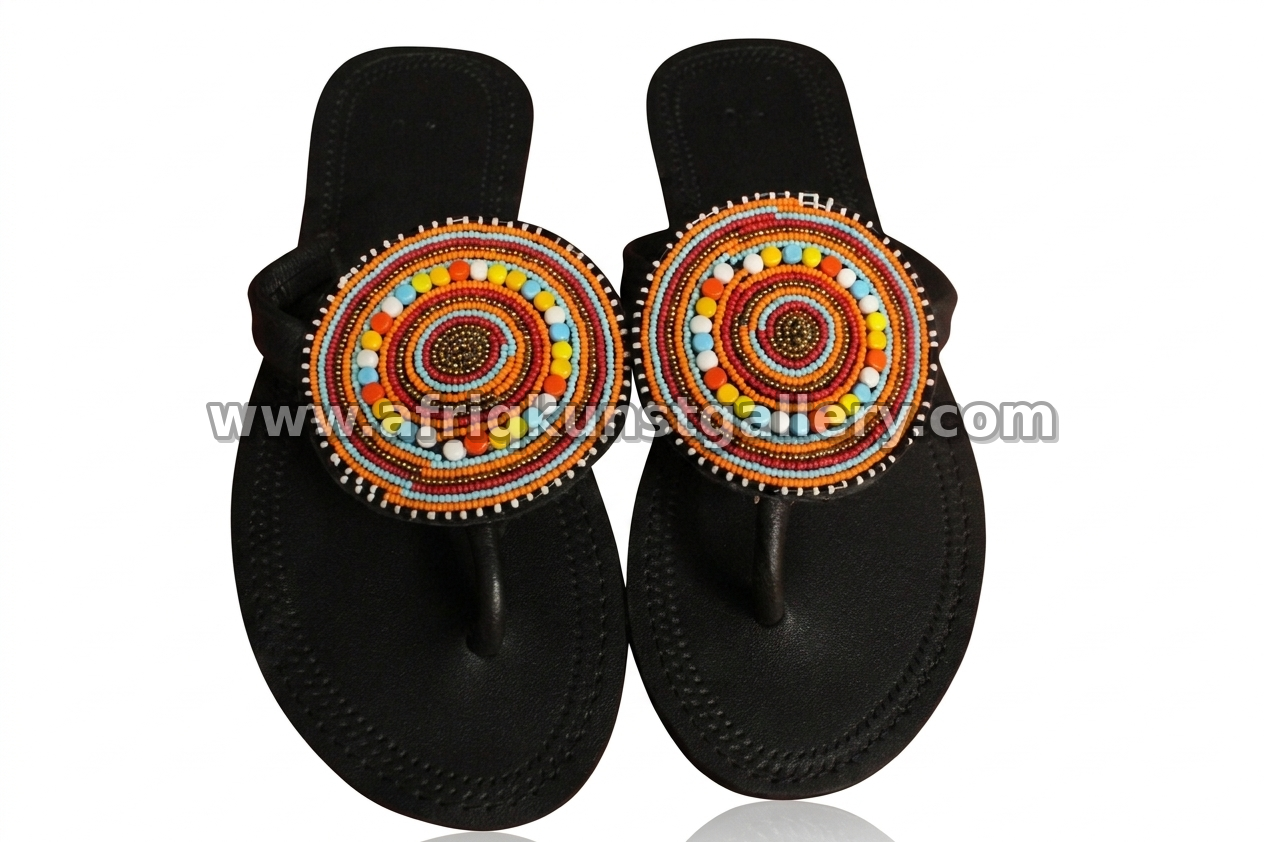 Black sandals topped with large round beaded medallions.