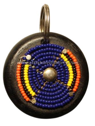 Round beaded keyholder with cobalt, orange and yellow beadwork.