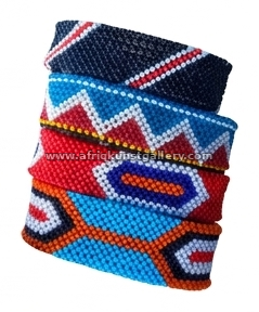 Geometric beaded cuff bracelet on a white background.